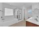 Bright bathroom with separate shower stall and soaker tub and double sinks at 5960 Addy Ln, North Las Vegas, NV 89081