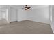 Spacious bedroom with plush carpet flooring and a ceiling fan at 5960 Addy Ln, North Las Vegas, NV 89081