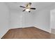 Bedroom featuring wood floors, closet with sliding doors, and a ceiling fan at 5960 Addy Ln, North Las Vegas, NV 89081