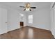 Bedroom boasts hardwood floors, a ceiling fan, and ensuite bathroom access at 5960 Addy Ln, North Las Vegas, NV 89081