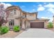 Charming two-story home featuring a well-manicured front yard and attached two-car garage at 5960 Addy Ln, North Las Vegas, NV 89081