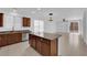 Open-concept kitchen featuring stainless steel appliances, a large island, and bright living space at 5960 Addy Ln, North Las Vegas, NV 89081