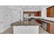 Charming kitchen featuring stainless steel appliances, granite countertops and tiled floors with natural light at 5960 Addy Ln, North Las Vegas, NV 89081
