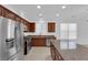 Charming kitchen featuring stainless steel appliances, granite countertops and tiled floors with natural light at 5960 Addy Ln, North Las Vegas, NV 89081