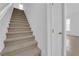 Stairway featuring carpeted steps and a white wall at 5960 Addy Ln, North Las Vegas, NV 89081