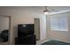 Spacious bedroom with plush carpeting, a ceiling fan, and ample natural light at 6830 Truffle Gray St, Las Vegas, NV 89148