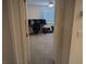 Bedroom with a gaming setup, neutral carpet, and ample natural light at 6830 Truffle Gray St, Las Vegas, NV 89148