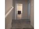 Upstairs hallway with neutral walls and carpet, leading to a bathroom at 6830 Truffle Gray St, Las Vegas, NV 89148