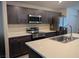 Kitchen featuring gray cabinets, stainless steel appliances, and quartz countertops at 6830 Truffle Gray St, Las Vegas, NV 89148