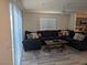 Bright living room features a comfortable sofa and decor, perfect for relaxation at 6830 Truffle Gray St, Las Vegas, NV 89148