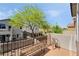 View from the balcony showing a mature tree and surrounding neighborhood at 7047 Sombra Way, Las Vegas, NV 89113