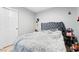 Bedroom features a gray upholstered headboard and neutral color bedding at 7047 Sombra Way, Las Vegas, NV 89113