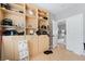 Bedroom featuring hardwood floors, a built-in shelves and drawers at 7047 Sombra Way, Las Vegas, NV 89113