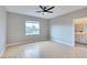 Spacious bedroom featuring wood floors, a ceiling fan, and a window at 7047 Sombra Way, Las Vegas, NV 89113