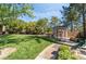 A community park provides a relaxing space to gather with lush lawns, walking paths, and a gazebo for outdoor enjoyment at 7047 Sombra Way, Las Vegas, NV 89113