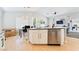 Spacious kitchen island with stainless dishwasher offers extra seating and counter space at 7047 Sombra Way, Las Vegas, NV 89113