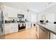 Modern kitchen boasts stainless appliances, sleek countertops, and stylish cabinetry at 7047 Sombra Way, Las Vegas, NV 89113