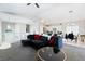 Bright living room featuring vaulted ceilings and an open floor plan with modern furnishings at 7047 Sombra Way, Las Vegas, NV 89113