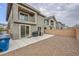 A private backyard with a gravel area, concrete patio, and complete privacy wall at 707 Cottonwood Hill Pl, Henderson, NV 89011