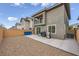 Wide view of the backyard featuring a gravel area, patio and a full privacy wall at 707 Cottonwood Hill Pl, Henderson, NV 89011