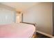 This bedroom has a closet with sliding doors, carpet and an attached bathroom at 707 Cottonwood Hill Pl, Henderson, NV 89011