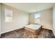 This bedroom is unfurnished with carpet, two windows and neutral-colored walls at 707 Cottonwood Hill Pl, Henderson, NV 89011
