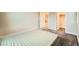 This bedroom features carpet and neutral-colored walls with access to the closet and bathroom at 707 Cottonwood Hill Pl, Henderson, NV 89011