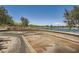 Scenic view of the community lake with walking paths and lush landscaping at 707 Cottonwood Hill Pl, Henderson, NV 89011
