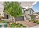 Charming two-story home featuring a two-car garage and nicely landscaped front yard at 707 Cottonwood Hill Pl, Henderson, NV 89011