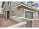 Exterior of a charming home with a brick driveway, landscaped yard, and an inviting facade at 707 Cottonwood Hill Pl, Henderson, NV 89011