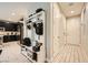 Hallway entrance featuring a stylish organizer, white doors, and sleek tile flooring at 707 Cottonwood Hill Pl, Henderson, NV 89011