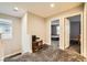 Upstairs hallway with carpet flooring showing access to various rooms and a window at 707 Cottonwood Hill Pl, Henderson, NV 89011