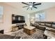 A large living room area with comfortable seating, modern décor, and plenty of natural light at 707 Cottonwood Hill Pl, Henderson, NV 89011
