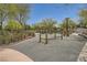 Community playground featuring wooden climbing structures and a rope net on a soft, safe surface at 707 Cottonwood Hill Pl, Henderson, NV 89011