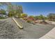 Community playground featuring two slides built into a landscaped hillside for Gathering enjoyment at 707 Cottonwood Hill Pl, Henderson, NV 89011