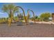 Swings located within a community playground surrounded by mature trees and landscaping at 707 Cottonwood Hill Pl, Henderson, NV 89011