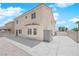 View of backyard featuring gravel, patio and a shed for storage. Adjacent to a wall offering a secure outdoor space at 720 Picasso Picture Ct, North Las Vegas, NV 89081
