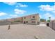 Expansive gravel backyard with concrete patio area, enclosed by a block wall, perfect for customization at 720 Picasso Picture Ct, North Las Vegas, NV 89081