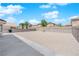 Spacious backyard with a gravel ground cover, concrete patio and block wall providing ample privacy at 720 Picasso Picture Ct, North Las Vegas, NV 89081