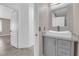 Bathroom featuring a modern vanity with a vessel sink, framed mirror and decorative sconce lighting at 720 Picasso Picture Ct, North Las Vegas, NV 89081