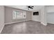 A spacious bedroom with tiled floors, neutral walls, ceiling fan and large bay window at 720 Picasso Picture Ct, North Las Vegas, NV 89081