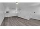 Large bonus room with wood-look flooring, white walls and bright windows at 720 Picasso Picture Ct, North Las Vegas, NV 89081