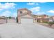 Inviting home with a large driveway and beautiful exterior features for a comfortable and stylish living experience at 720 Picasso Picture Ct, North Las Vegas, NV 89081