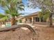 Beautiful backyard with a pool, lush landscaping, and a covered patio at 7505 Java Sparrow St, North Las Vegas, NV 89084