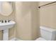 Powder bathroom features a pedestal sink and neutral colored walls at 7505 Java Sparrow St, North Las Vegas, NV 89084