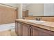 Bathroom with double sink vanity, tile backsplash, and a separate toilet area at 7505 Java Sparrow St, North Las Vegas, NV 89084