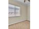 Bright bedroom with a large window and neutral carpet at 7505 Java Sparrow St, North Las Vegas, NV 89084