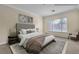 Comfortable bedroom with large window at 7505 Java Sparrow St, North Las Vegas, NV 89084