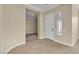 Inviting entryway with tile flooring, a white front door, and ample natural light at 7505 Java Sparrow St, North Las Vegas, NV 89084