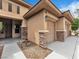 Well-maintained home featuring a two-car garage, desert landscaping, and a quaint covered entryway at 7505 Java Sparrow St, North Las Vegas, NV 89084